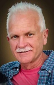 Charlie Roberts, author of the series of Faith books, including Parking Lot Faith, and the 2025 new book release, Running Towards the Light